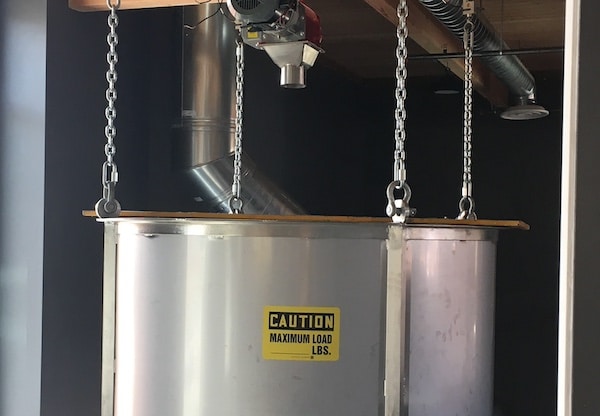Grist case hanging on load cells above the mash