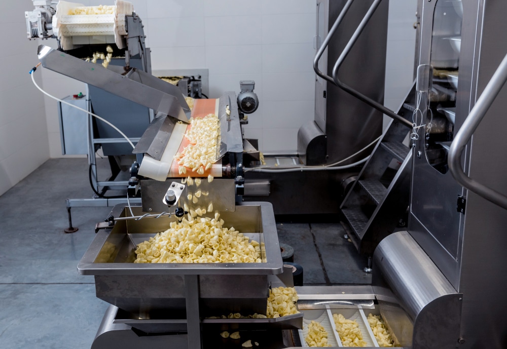 Pasta being cut and conveyed