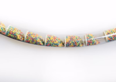 Tubular drag conveying fruit loops