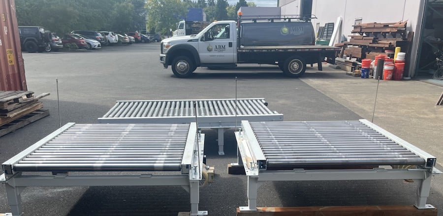 Used Wulftec powered roller conveyors layed out