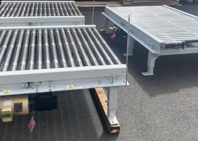 Used powered wulftec roller conveyors outside