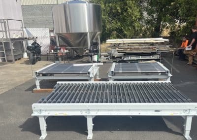 Used wulftec powered roller conveyors for sale arranged outside