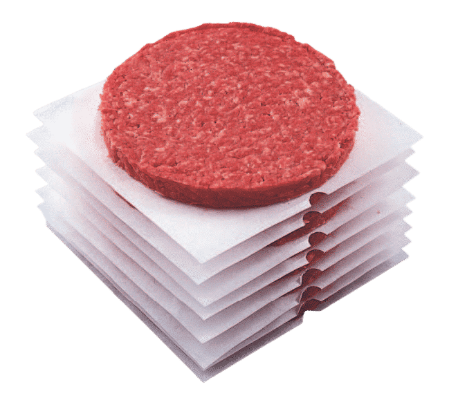 Patties out of a portioner with paper sleeves automatically placed between them