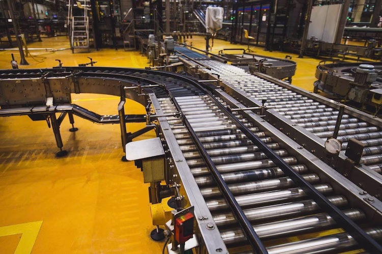 Roller and belt conveyors integrated in facility
